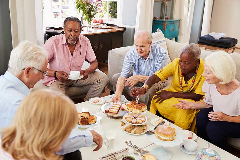 senior friends enjoying afternoon tea