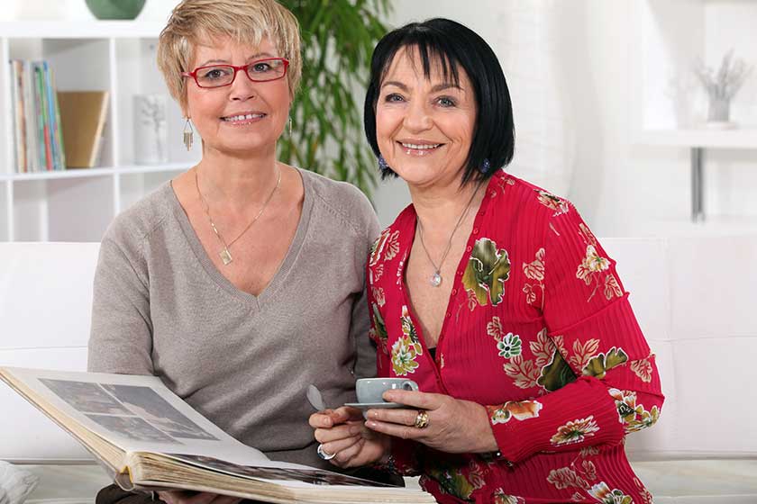 senior women watching a photo album