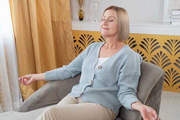blond senior woman relaxing calming looking future concept life balance