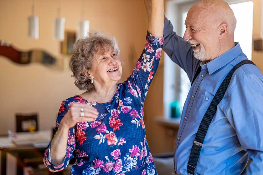 happy senior couple dancing together home happy senior couple dancing together home