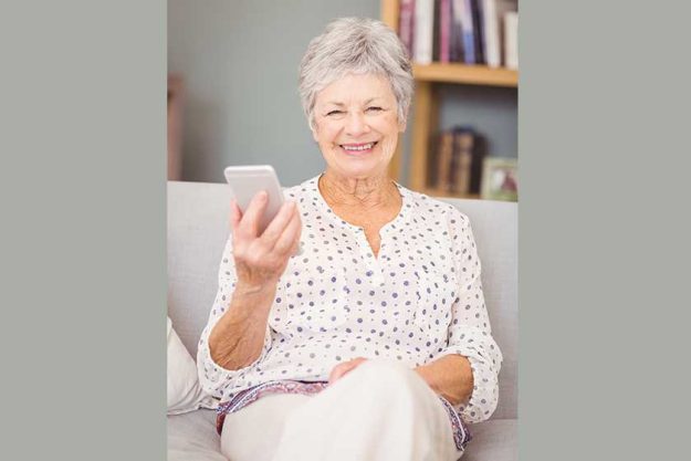 senior woman holding mobile phone
