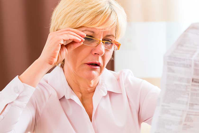 senior woman reading with presbyopia