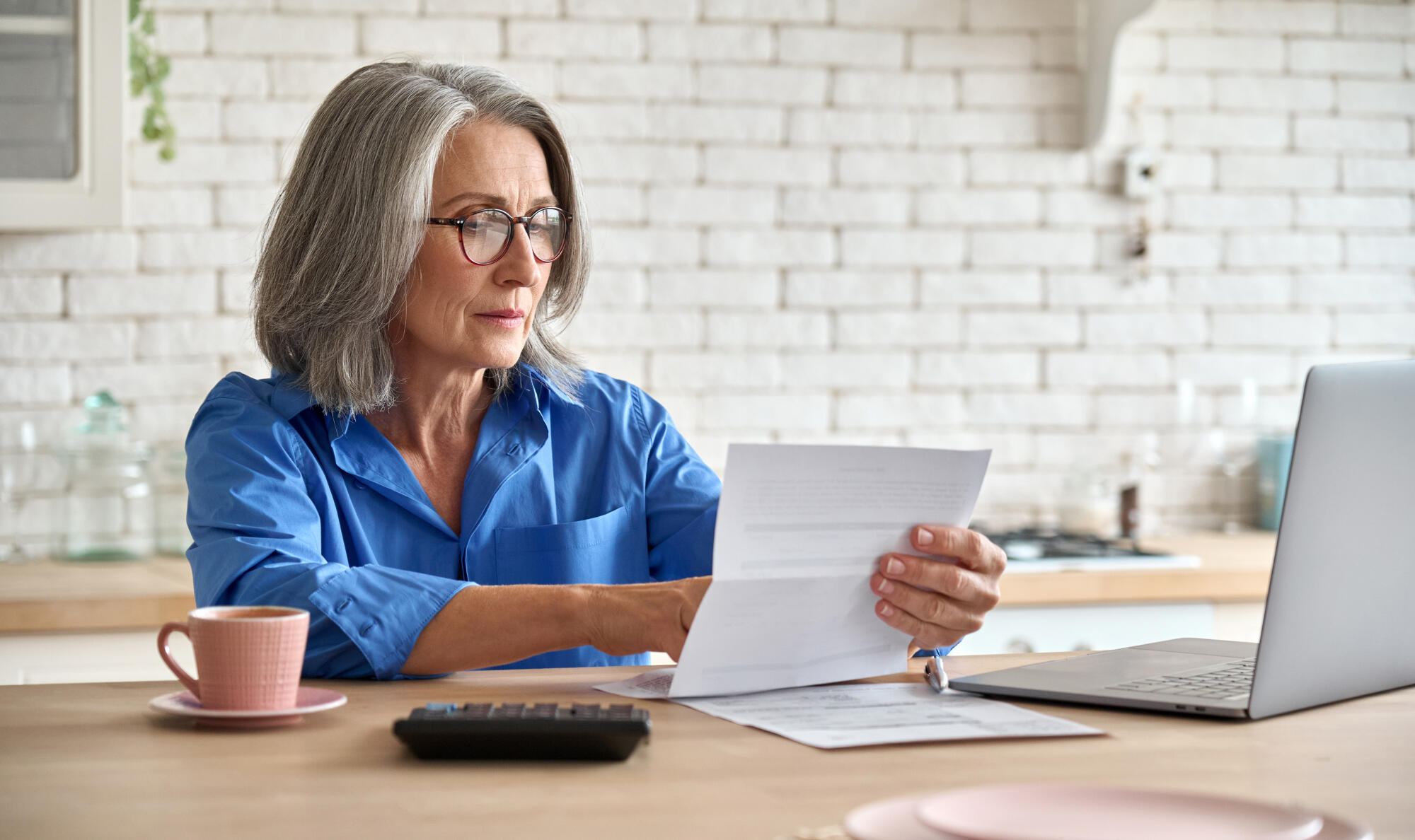 Adult,Senior,60s,Woman,Working,At,Home,At,Laptop.,Serious