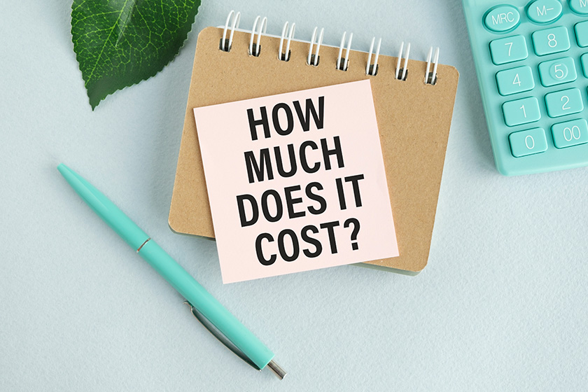 how much does cost business concept text white notepad paper how much does cost business concept text white notepad paper