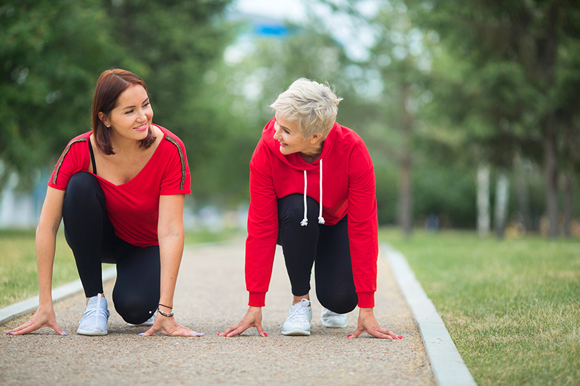 two adult women sportswear preparing summer run park
