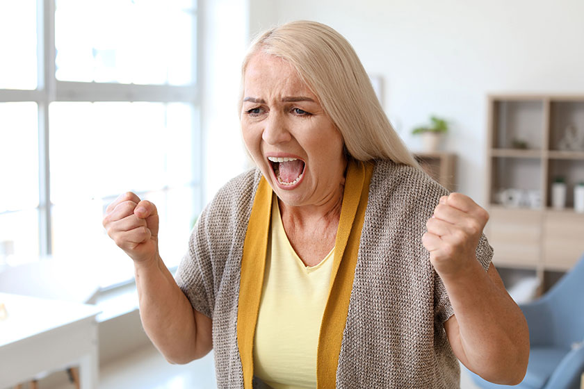 Angry mature woman at home
