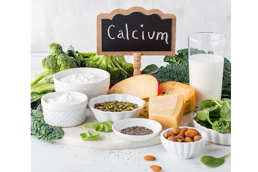 Arrangement assorted raw whole foods high calcium including greens nuts Arrangement assorted raw whole foods high calcium including greens nuts