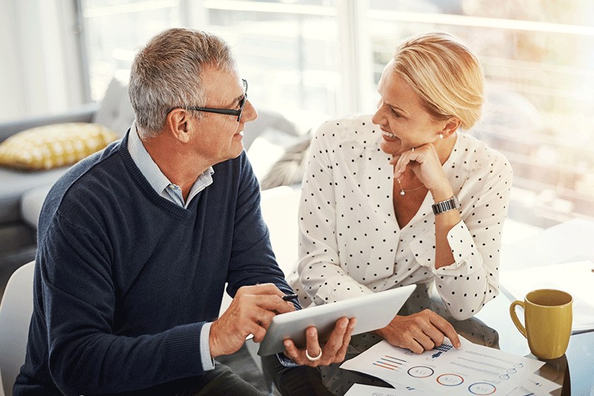 building solid household budget mature couple using digital tablet building solid household budget mature couple using digital tablet