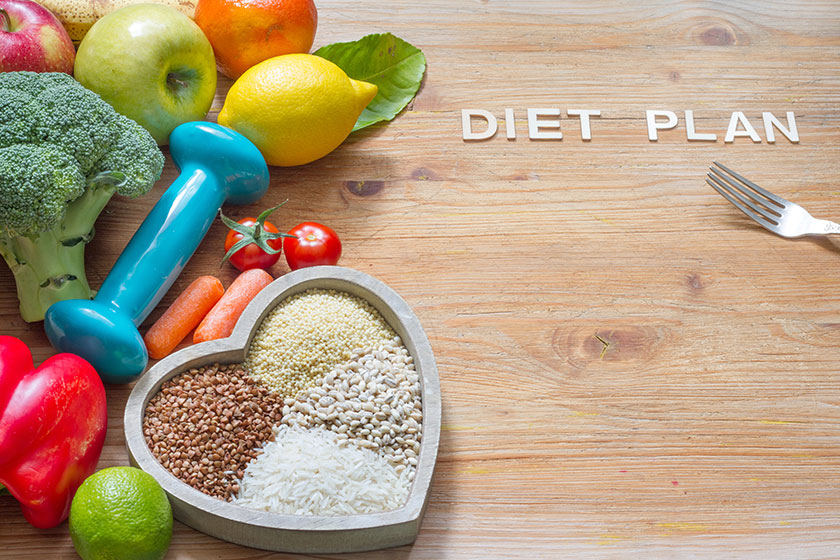 Diet plan healthy lifestyle concept vegetarian food heart gym dumbbell