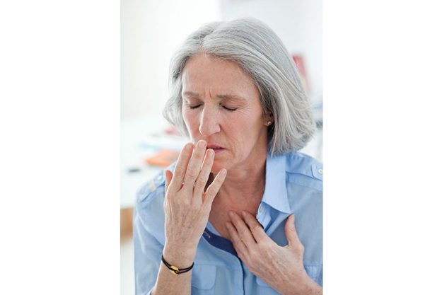 Elderly person coughing
