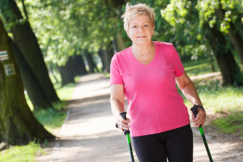 elderly senior woman practicing nordic walking elderly senior woman practicing nordic walking
