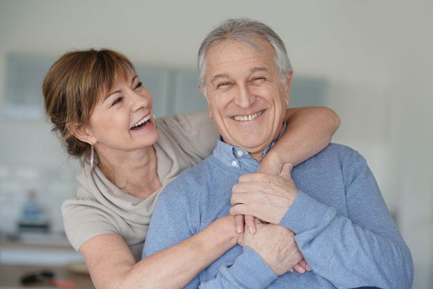 Portrait happy senior couple home