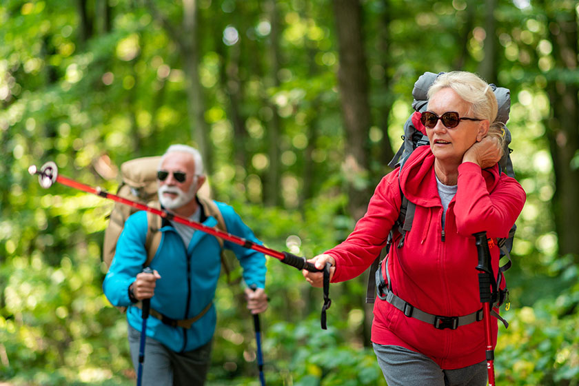 Senior couple backpacks hiking have fun nature love people nature Senior couple backpacks hiking have fun nature love people nature