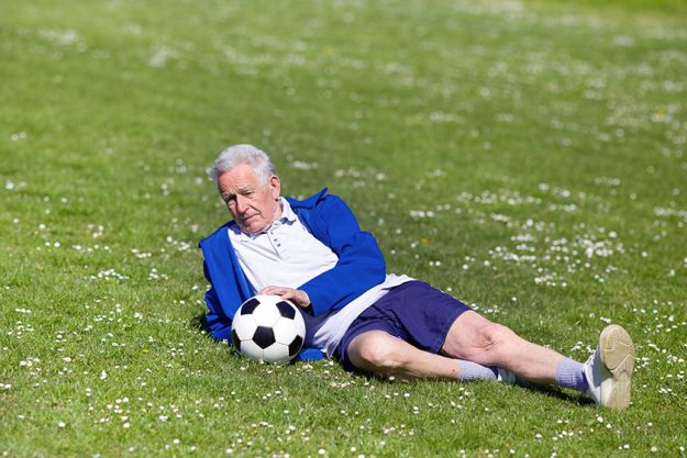 Senior footbal player on grass Senior footbal player on grass