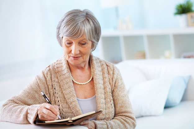 senior woman making notes