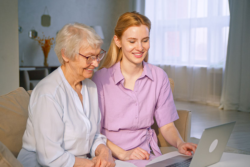 Smiling family talking to camera making conference video call mother and daughter doing video chat Smiling family talking to camera making conference video call mother and daughter doing video chat