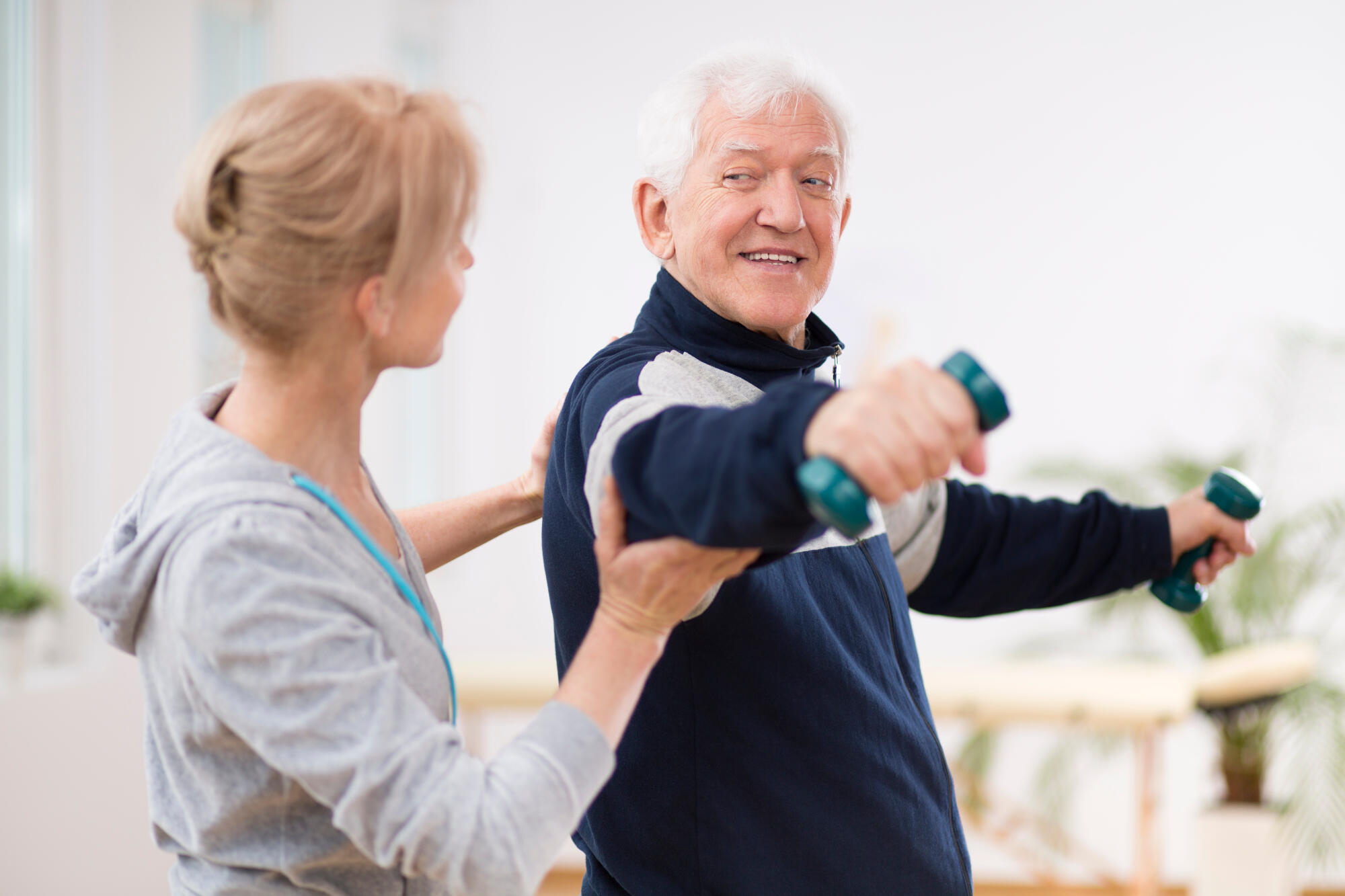 Senior,Man,After,Stroke,At,Nursing,Home,Exercising,With,Professional Senior,Man,After,Stroke,At,Nursing,Home,Exercising,With,Professional