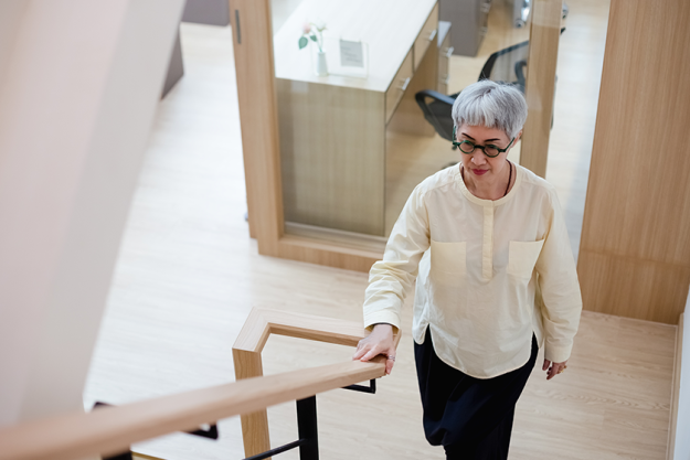 asian elderly woman walking stairs