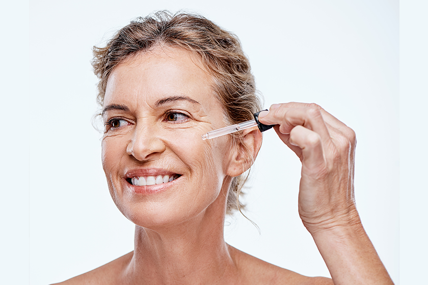 can see skin becoming firmer smoother mature woman posing serum