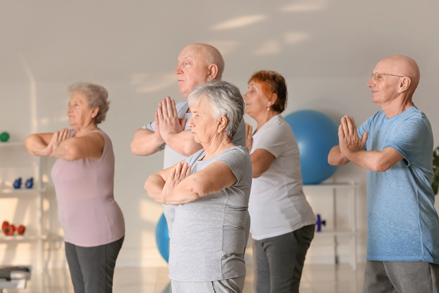 elderly people exercising gym