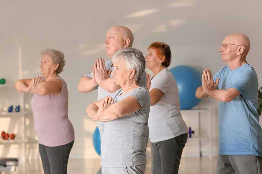 elderly people exercising gym