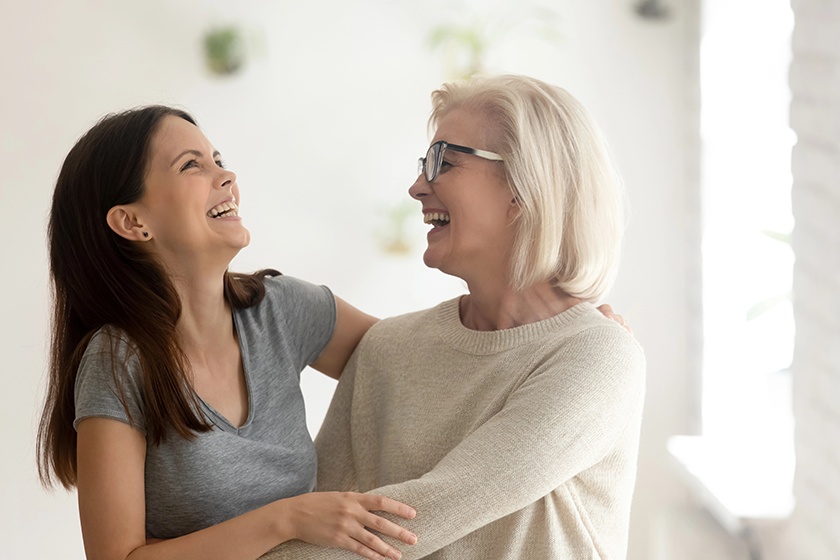 happy aged mother and millennial daughter