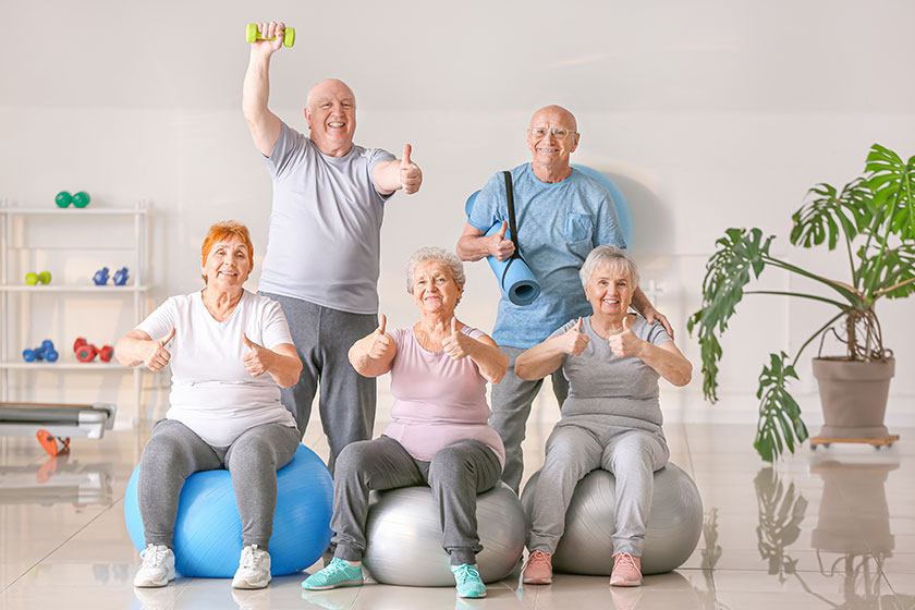 Happy elderly people gym