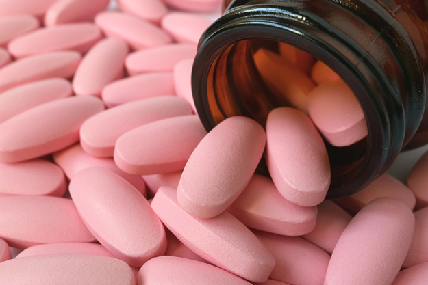 heap light pink color oval shaped pills