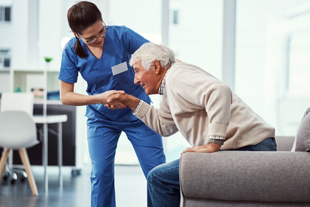 just needs hand young female nurse helping her senior patient