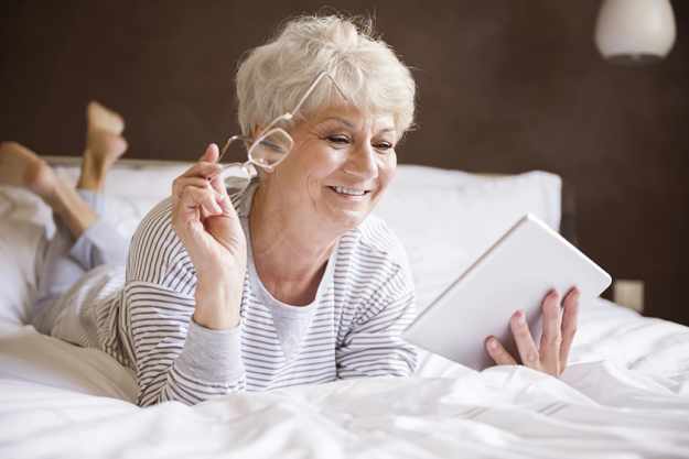 mature woman using tablet mature woman using tablet