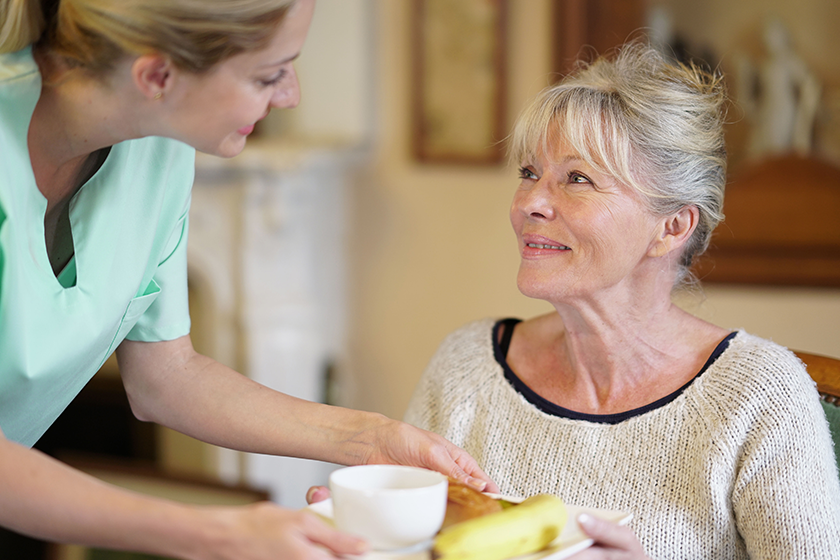 nurse bringing breakfast