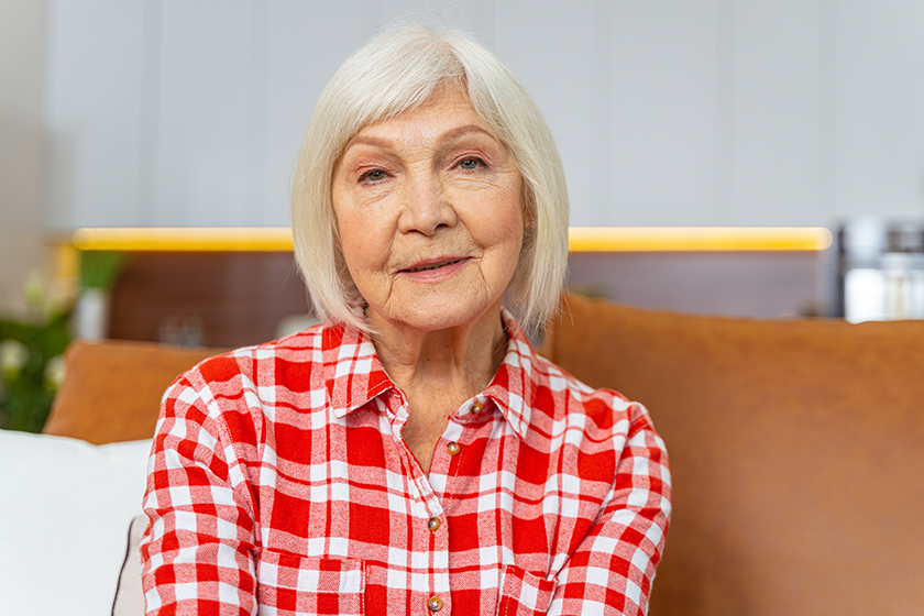 pleasant aged lady sitting in the room pleasant aged lady sitting in the room