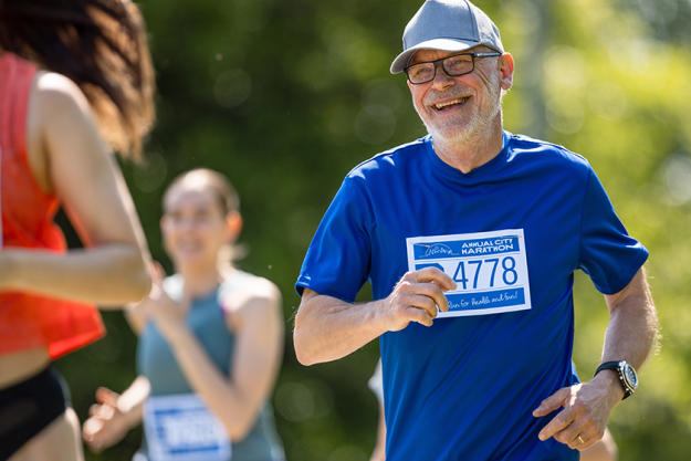 portrait senior male jogger running