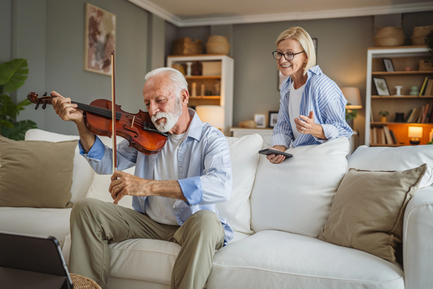 senior man learn play violin
