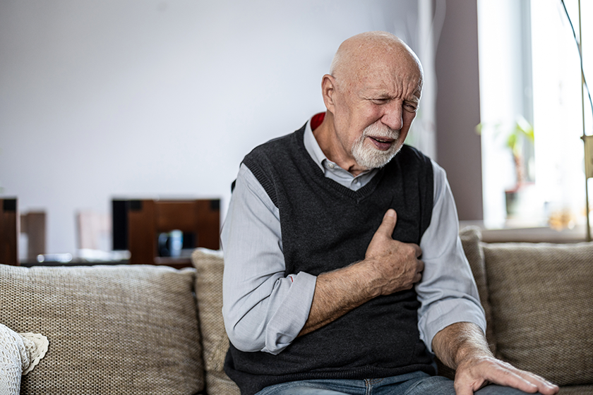 senior man suffering chest pain