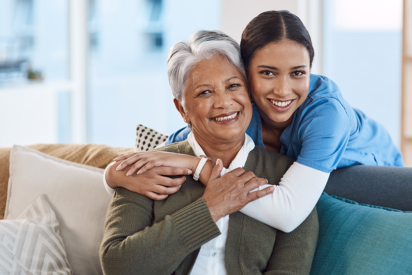 smile portrait nurse hugging old woman