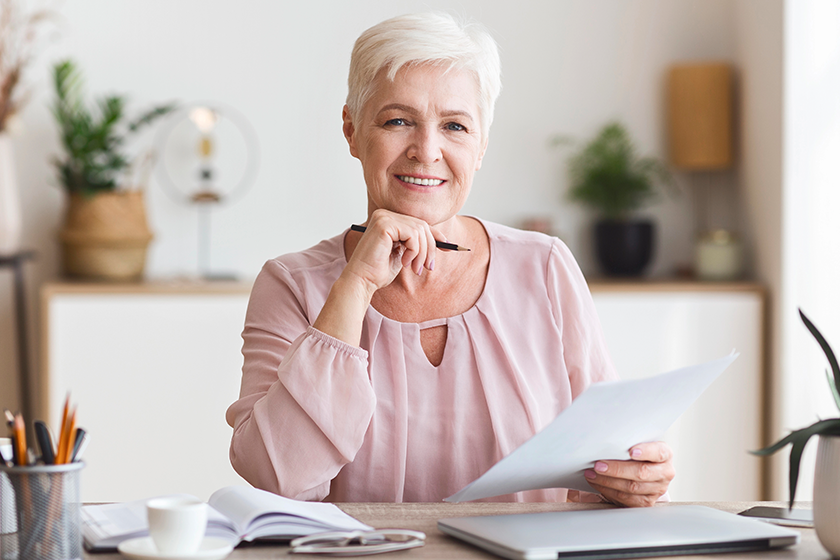 smiling senior business woman working with documents smiling senior business woman working with documents