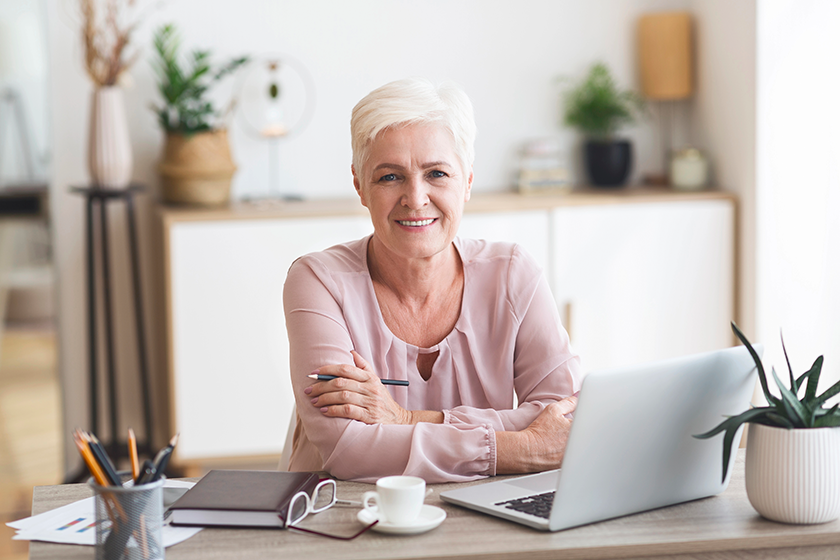 smiling senior business woman working with laptop smiling senior business woman working with laptop