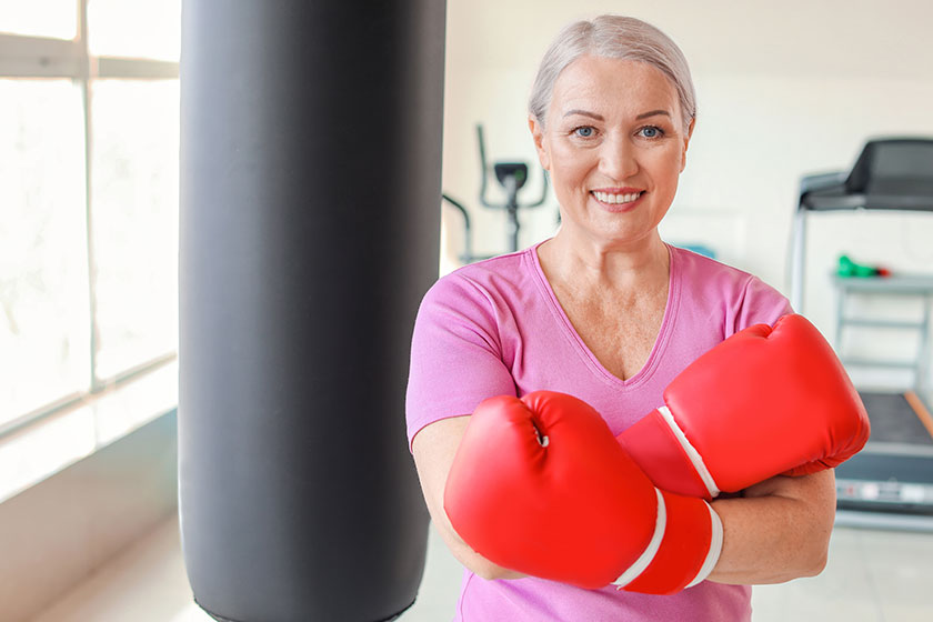 Sporty mature female boxer gym