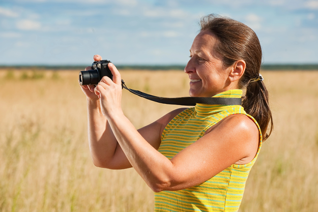 woman taking photo with camera woman taking photo with camera