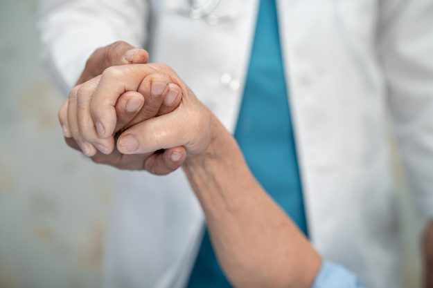 Holding hands Asian senior or elderly old lady woman patient wit Holding hands Asian senior or elderly old lady woman patient wit