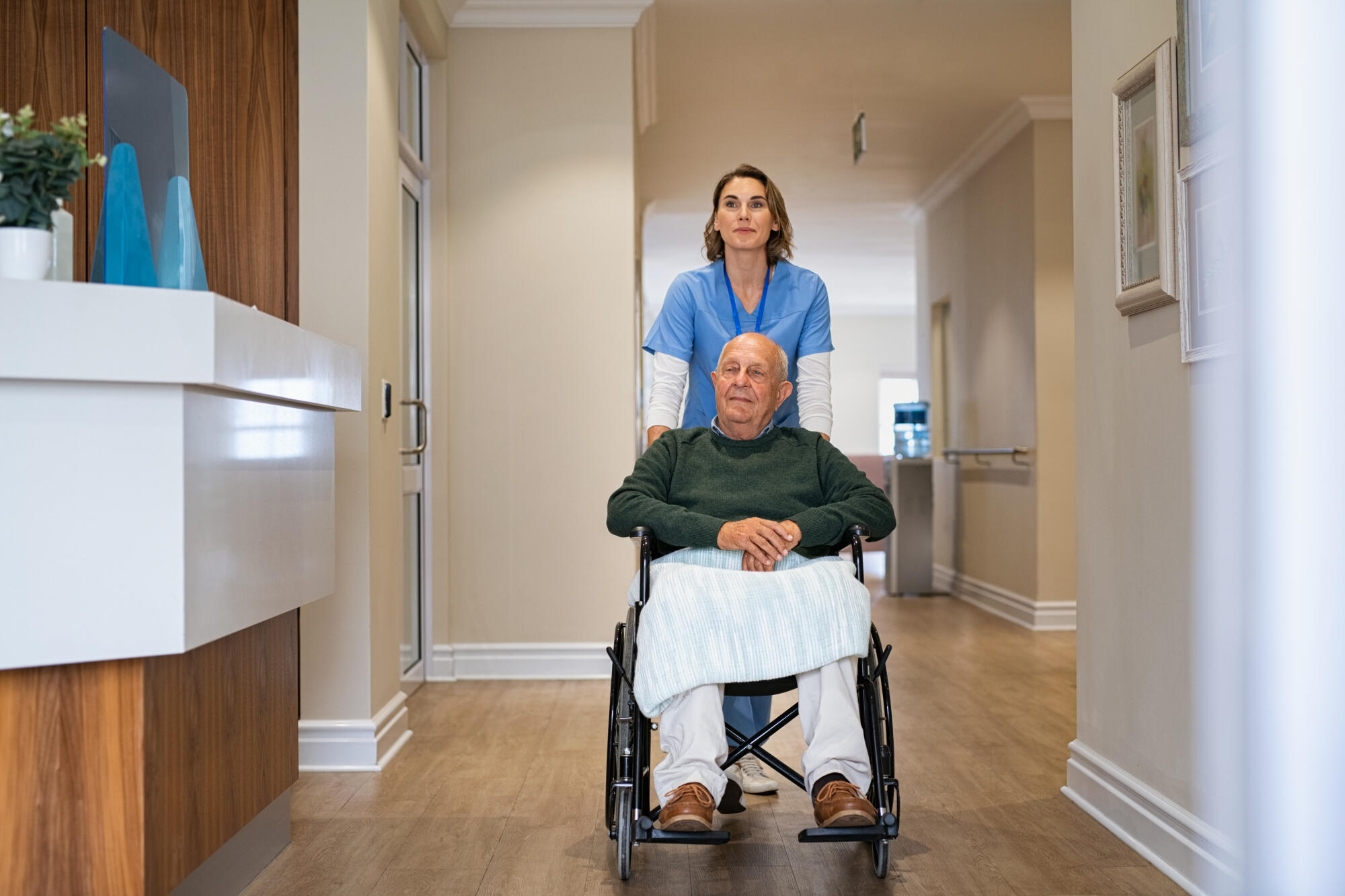 Nurse,Helping,Old,Man,In,Wheelchair,In,Nursing,Home.,Healthcare Nurse,Helping,Old,Man,In,Wheelchair,In,Nursing,Home.,Healthcare