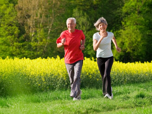 Senior,Couple,Jogging,On,A,Beautiful,Spring,Day,Out,In Senior,Couple,Jogging,On,A,Beautiful,Spring,Day,Out,In