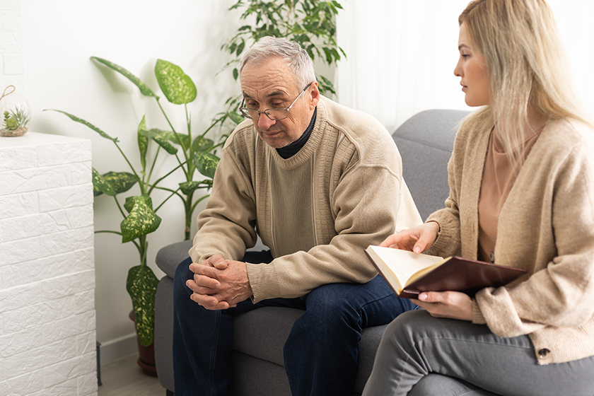 Close anxious serious old man listening female doctor meeting hospital Close anxious serious old man listening female doctor meeting hospital