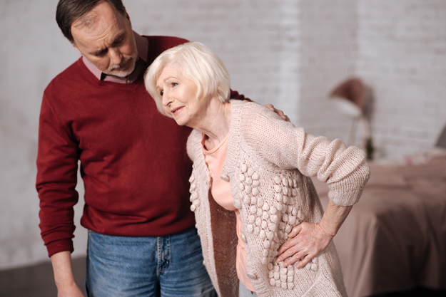 elderly lady with pain near her husband elderly lady with pain near her husband