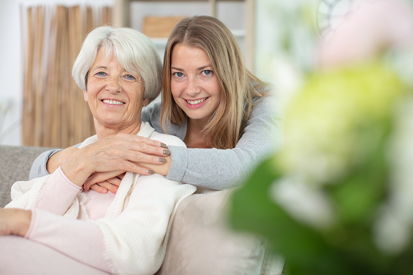 happy beautiful older mother adult daughter looking camera