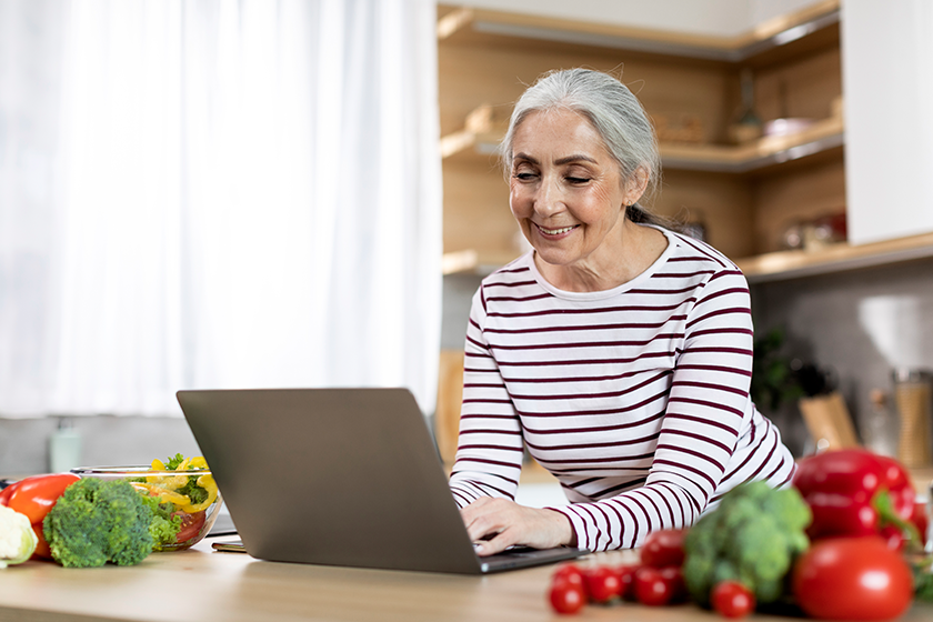 portrait smiling elderly lady using laptop portrait smiling elderly lady using laptop