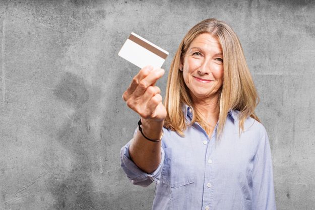 Senior beautiful woman with credit card