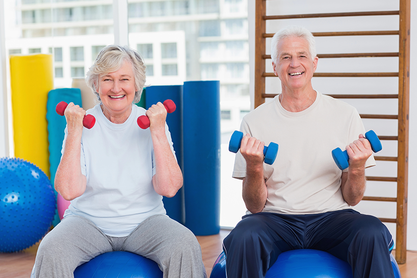Senior couple lifting dumbbells Senior couple lifting dumbbells