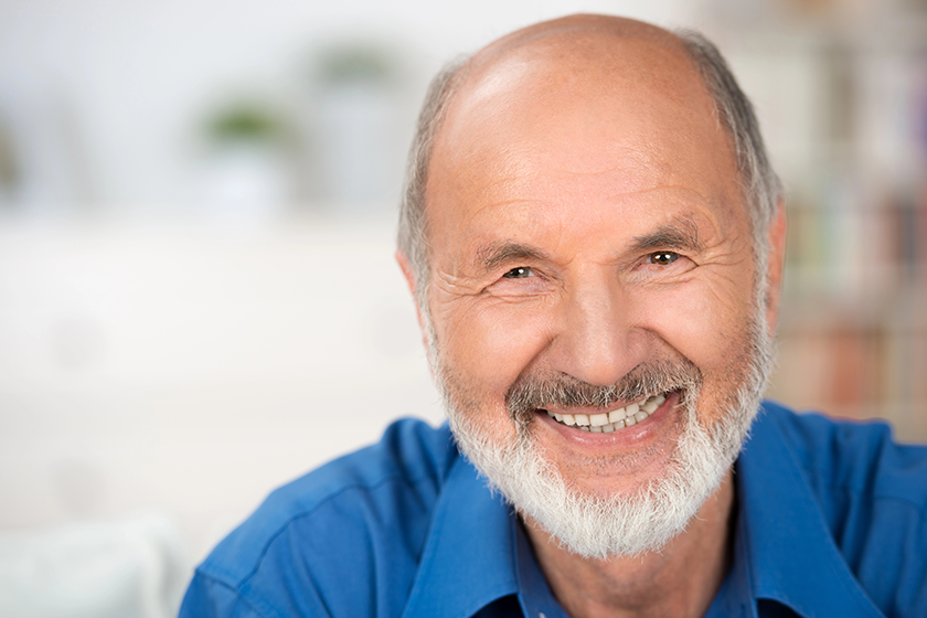 portrait of a smiling attractive senior man